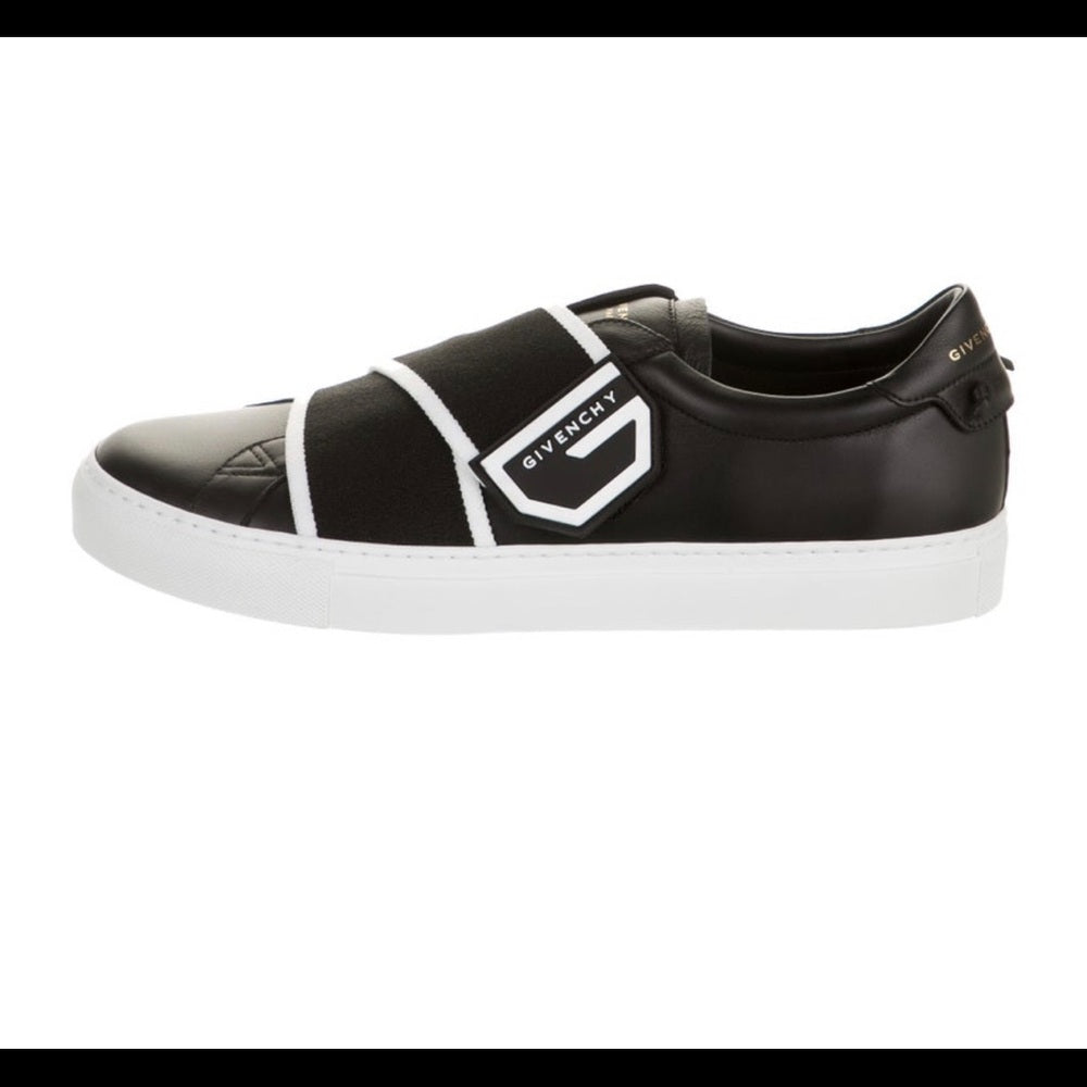 Givenchy leather slip-on sneakers.Round toes. Velcro closure at uppers.